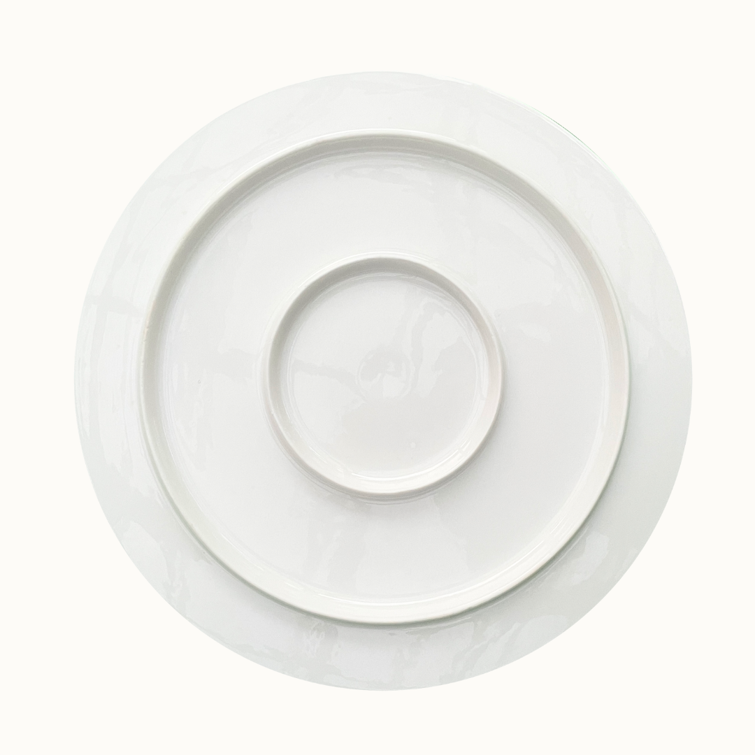 Close up of white ceramic cake platter back 